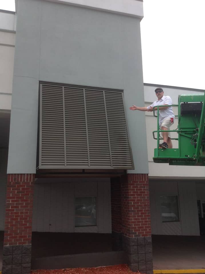Installing shutters on commercial building