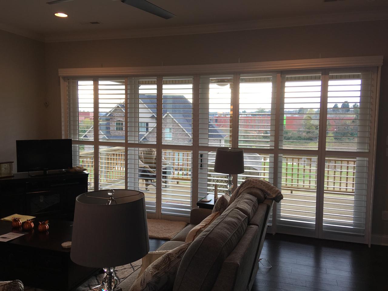 Sliding glass doors with bypass interior shutters
