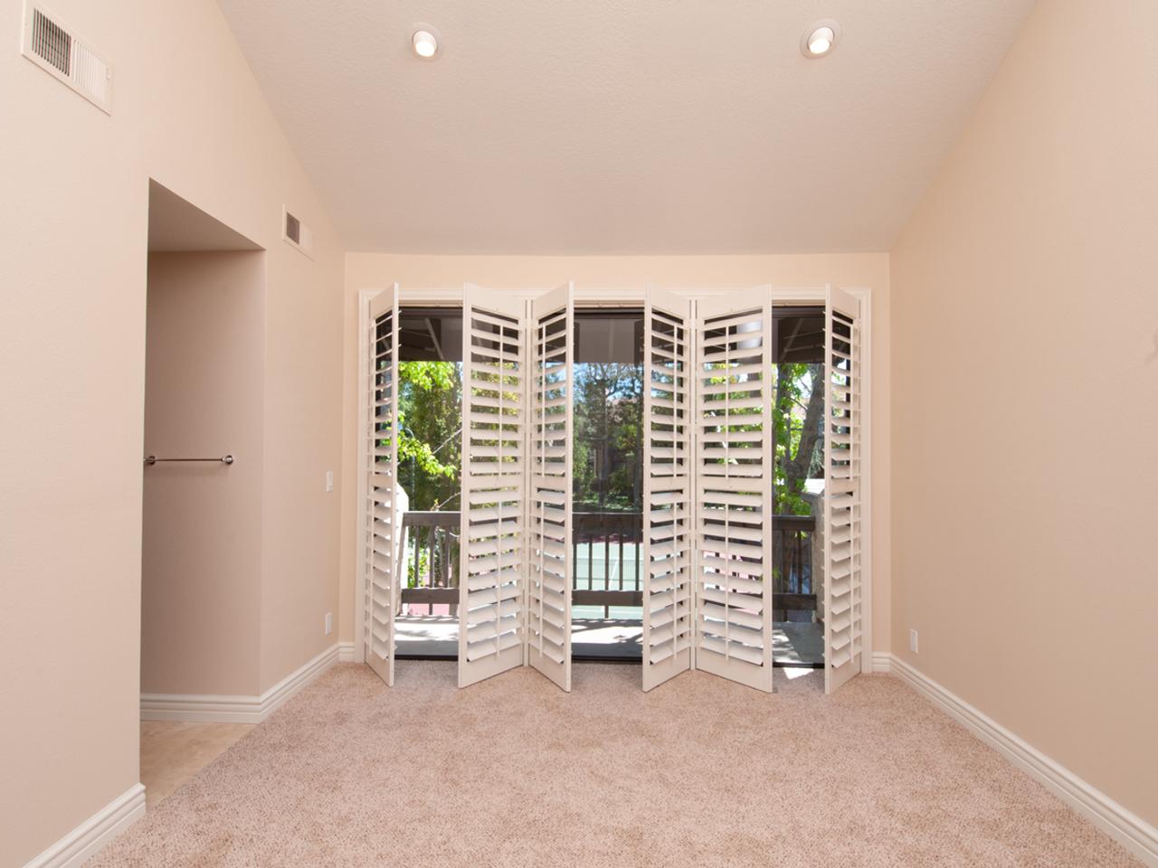 Sliding glass doors with plantation shutters opened