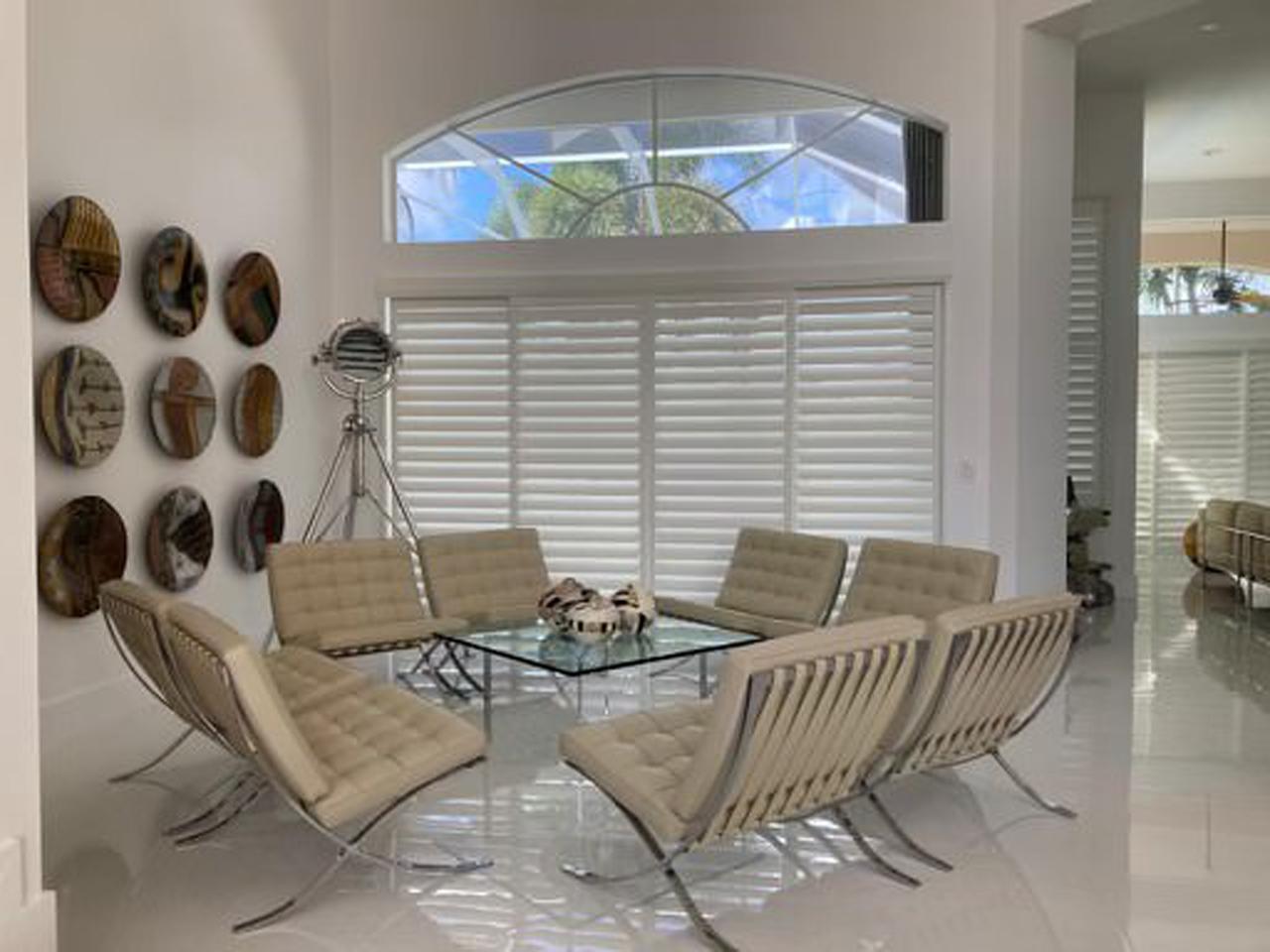 Dining room with interior shutters on sliding glass door