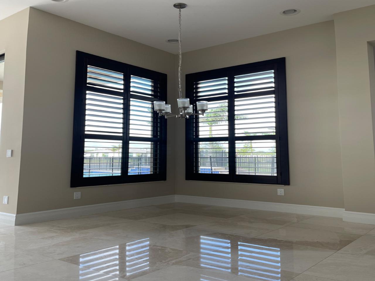 Dark stained shutters in dining area