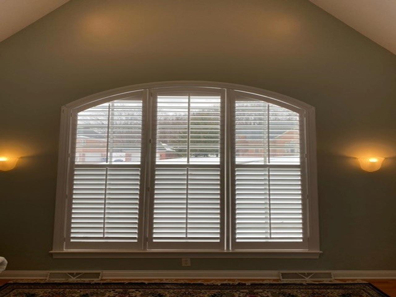 Arched windows with shutters