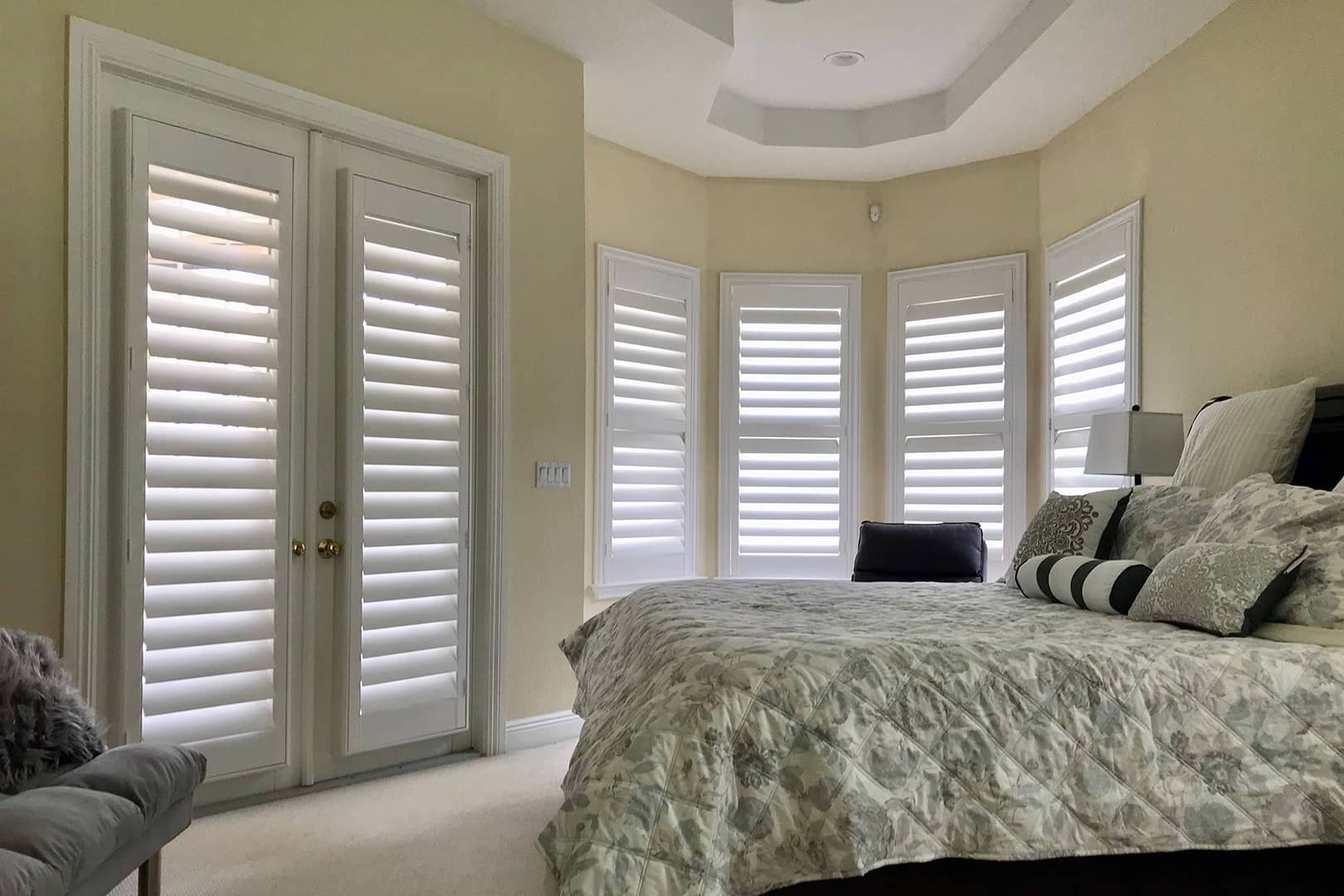 LouverWood plantation shutters on French doors and bay windows