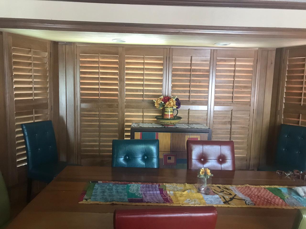 Dining room with stained shutters