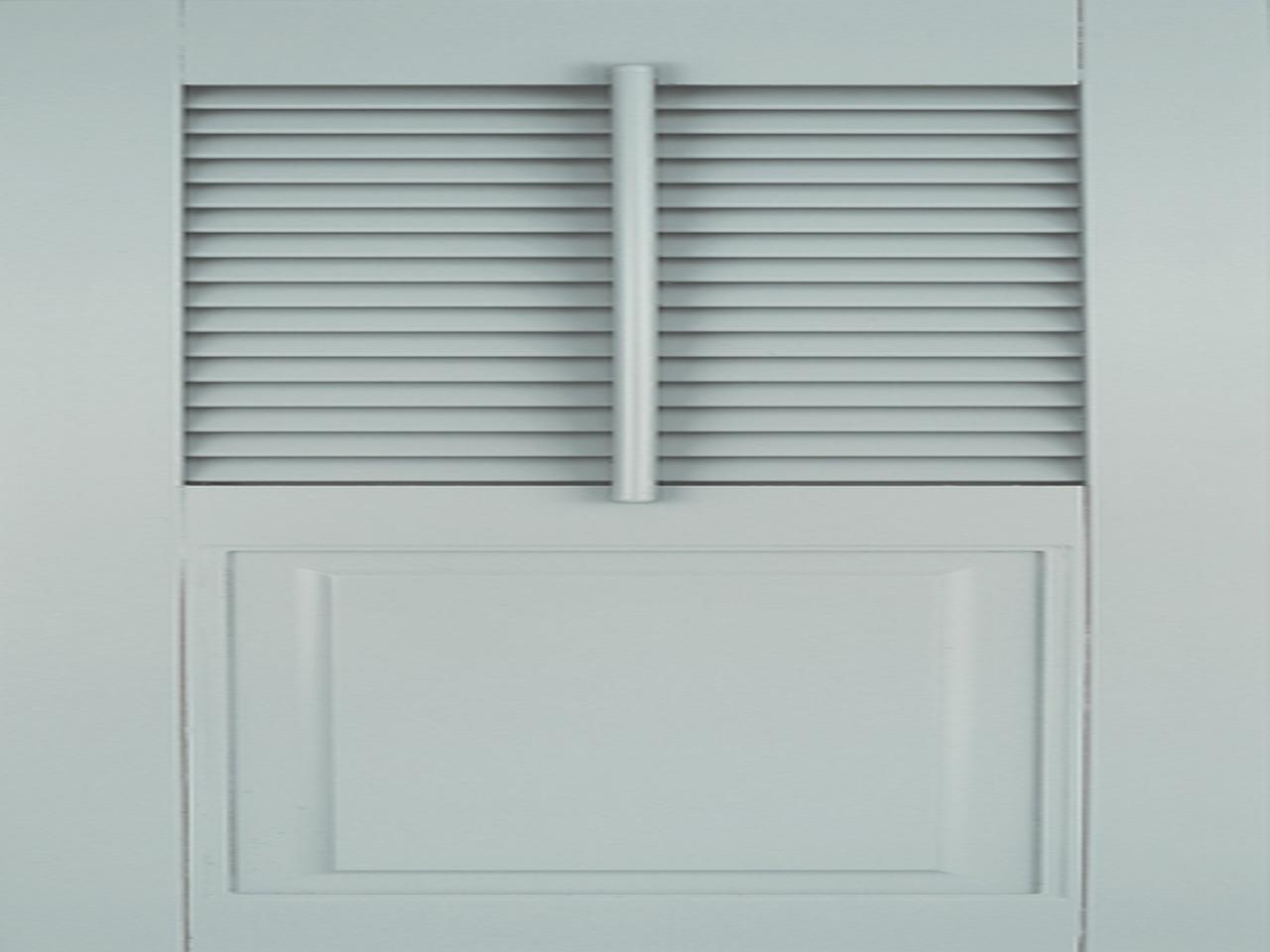 Light gray louvered and raised panel shutters