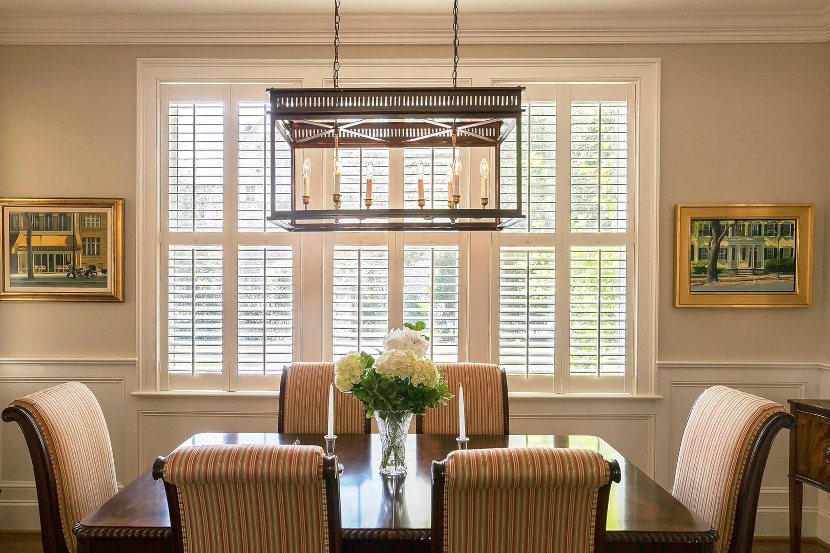 white shutters on large dining room window